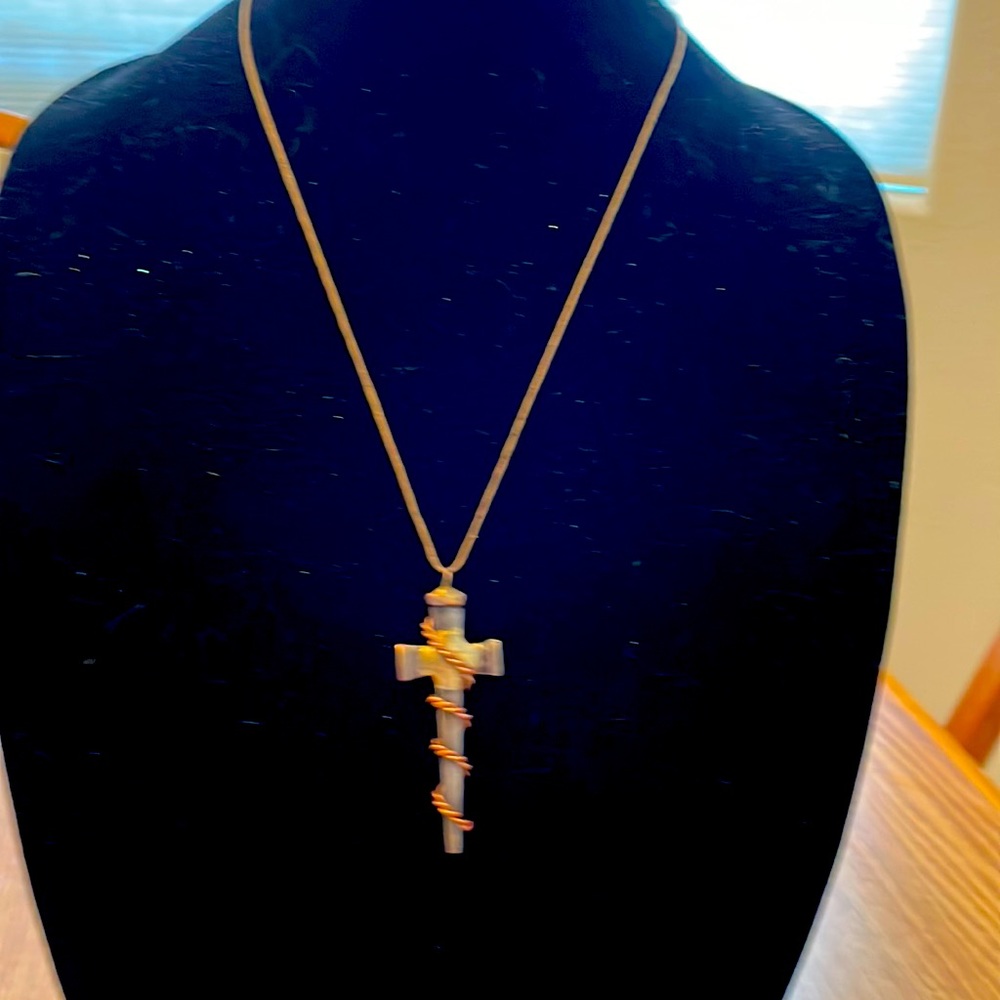 Metal copper & burnished gold cross 11” necklace. Brown cord slip over the head.